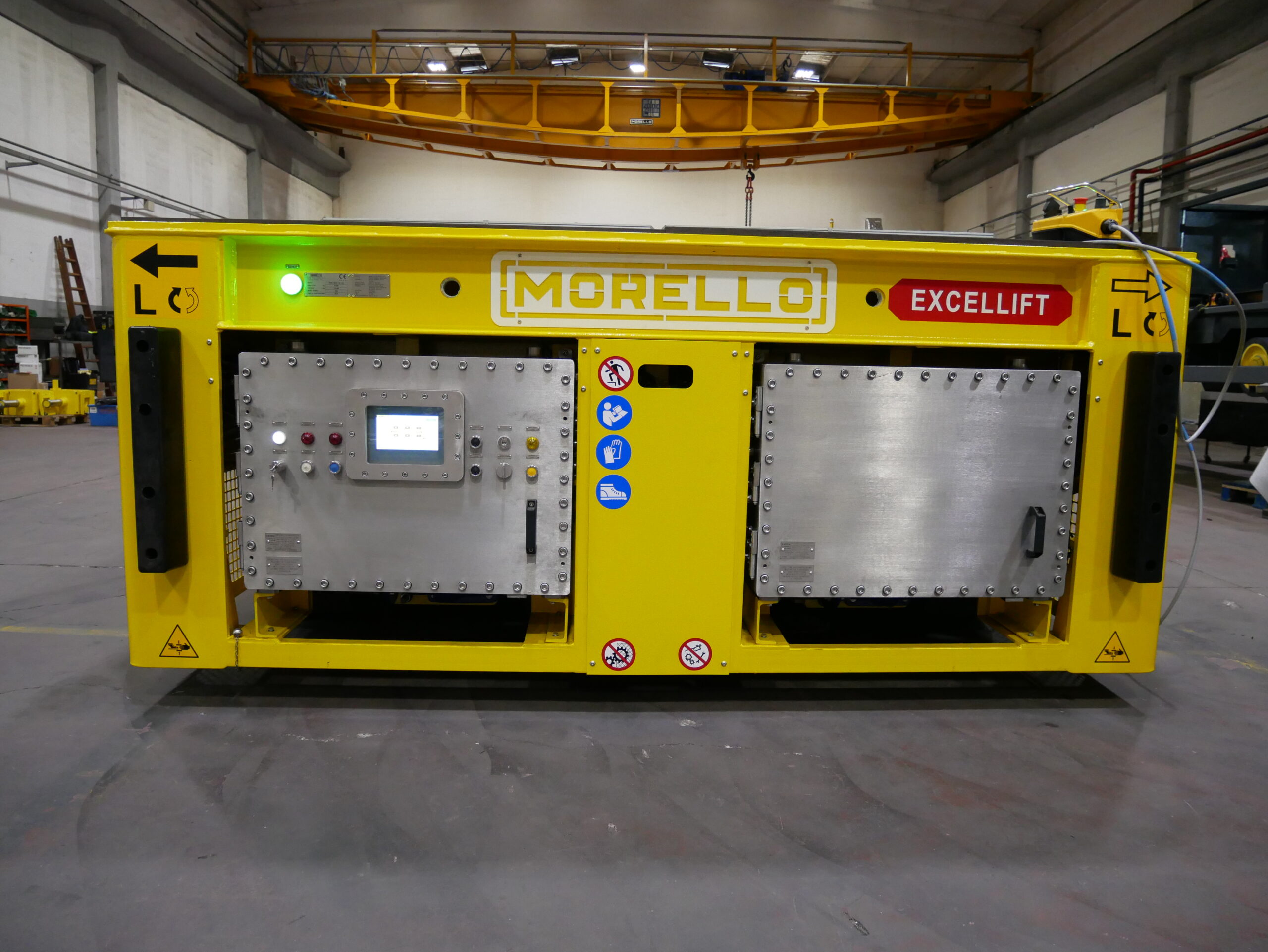 ATEX-certified rear service module with flameproof electrical cabinets, HMI touchscreen, local controls and heavy-duty protected chassis for operation in hazardous environments.
